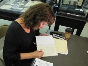 Diane Sahms-Guarnieri signs books at Ryerss Museum & Library. Photo by G.E. Reutter