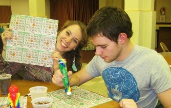 Mary Guarnieri and Connor McGuckin check out their bingo cards at the Loudenslager American Legion Post. Photo by G.E. Reutter